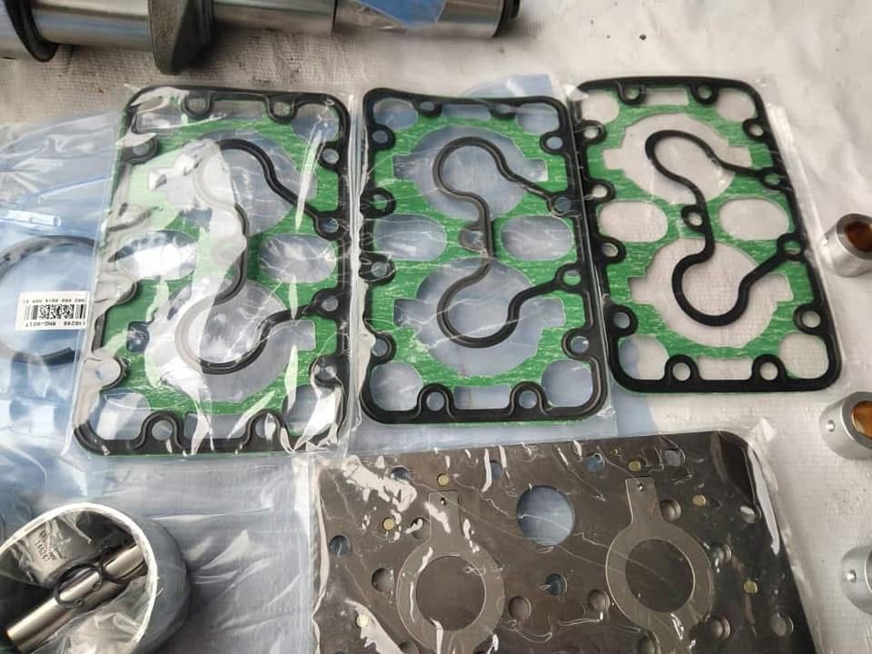 Compressor gaskets and valve plates